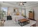 Bright main bedroom offering a plush bed, decorative pillows, and elegant furnishings at 16034 Rushwick Dr, Huntersville, NC 28078