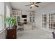 Well-lit home office with custom cabinets and shelving, perfect for remote work at 16034 Rushwick Dr, Huntersville, NC 28078