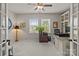 Home office with natural light, custom built-ins, and a comfortable workspace at 16034 Rushwick Dr, Huntersville, NC 28078