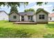 The backyard shows a wooden deck and grilling area, perfect for outdoor entertaining at 1626 Riverglenn Ct, Rock Hill, SC 29732