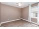 Neutral bedroom offers natural light, wood flooring, and a serene atmosphere at 1626 Riverglenn Ct, Rock Hill, SC 29732