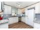 Bright kitchen with white cabinets, granite countertops, and modern appliances at 1626 Riverglenn Ct, Rock Hill, SC 29732