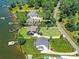 Lake Norman waterfront homes with lush green lawns and private docks provide serene lake living at 164 Twin Sisters Ln, Mooresville, NC 28117