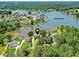 Aerial shot of Lake Norman home surrounded by lush trees and landscaping near the water at 164 Twin Sisters Ln, Mooresville, NC 28117