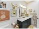 Stylish bathroom featuring a marble countertop, decorative gold accents, and unique wall decor that adds character at 164 Twin Sisters Ln, Mooresville, NC 28117