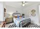 Charming bedroom with a black metal bed frame, colorful bedding, and eclectic decor at 164 Twin Sisters Ln, Mooresville, NC 28117