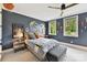 Comfortable bedroom with accent lighting, window views, and stylish furniture at 164 Twin Sisters Ln, Mooresville, NC 28117
