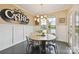 Dining room with lake views, stylish light fixture, and decorative wall accents at 164 Twin Sisters Ln, Mooresville, NC 28117