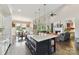 Spacious kitchen with granite island, modern appliances, and views of the living room at 164 Twin Sisters Ln, Mooresville, NC 28117