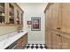 Pantry with custom cabinets, quartz countertops and decorative black and white floor at 164 Twin Sisters Ln, Mooresville, NC 28117