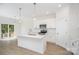 Modern kitchen with white cabinets, stainless steel appliances, an island, and pendant lighting at 1807 Country Club Rd, Lincolnton, NC 28092