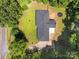 Aerial view of the house surrounded by lush greenery; roof and trampoline are visible at 1810 Country Manor Ln # 34, Rock Hill, SC 29730