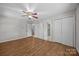 Spacious bedroom with hardwood floors, ceiling fan, and ample closet space at 1810 Country Manor Ln # 34, Rock Hill, SC 29730