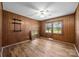 Bedroom with wood paneled walls, laminate floors, and a ceiling fan at 1810 Country Manor Ln # 34, Rock Hill, SC 29730