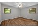 Cozy bedroom featuring hardwood floors, natural light, and a ceiling fan at 1810 Country Manor Ln # 34, Rock Hill, SC 29730