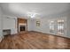 Open living room with hardwood floors, ceiling fan, brick fireplace and access to the exterior at 1810 Country Manor Ln # 34, Rock Hill, SC 29730