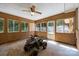 Enclosed sun room with paneled walls, ceiling fan and multiple windows at 1810 Country Manor Ln # 34, Rock Hill, SC 29730