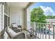 Relaxing balcony with comfortable seating and a view of the surrounding neighborhood at 18605 Ruffner Dr # 3E, Cornelius, NC 28031