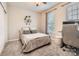 Bright bedroom with neutral decor, a comfortable bed, and a dedicated workspace at 18605 Ruffner Dr # 3E, Cornelius, NC 28031
