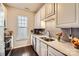 Well-lit kitchen featuring granite countertops, subway tile backsplash, and stainless steel appliances at 18605 Ruffner Dr # 3E, Cornelius, NC 28031