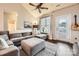 Comfortable living room with a gray sectional sofa, hardwood floors, and a door to the outside at 18605 Ruffner Dr # 3E, Cornelius, NC 28031