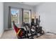 Bedroom featuring a racing simulator with a comfortable seat and natural light at 20324 Middletown Rd, Cornelius, NC 28031
