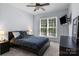 Cozy bedroom with ceiling fan, natural light, and neutral color palette at 20324 Middletown Rd, Cornelius, NC 28031