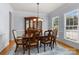 Traditional dining room with a wooden table, upholstered chairs, and a decorative china cabinet at 20324 Middletown Rd, Cornelius, NC 28031