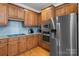Modern kitchen with stainless steel appliances, granite countertops, and ample cabinet space at 20324 Middletown Rd, Cornelius, NC 28031