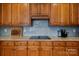 Close up of modern kitchen with granite countertops, stainless steel cooktop, and custom cabinetry at 20324 Middletown Rd, Cornelius, NC 28031