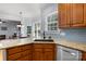 Beautiful kitchen with granite countertops, a stainless steel dishwasher, and modern finishes at 20324 Middletown Rd, Cornelius, NC 28031