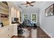 Bright home office with built-in shelving, hardwood floors, and natural light from the dual windows at 20324 Middletown Rd, Cornelius, NC 28031