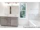 Elegant bathroom with double sinks, marble accents, and a soaking tub at 236 Wheatfield Dr # 102P, Statesville, NC 28677