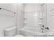 Well-lit bathroom featuring a soaking tub and tiled shower with glass door at 236 Wheatfield Dr # 102P, Statesville, NC 28677