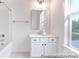 Bright bathroom with white cabinetry, tile floor, and shower-tub combination at 236 Wheatfield Dr # 102P, Statesville, NC 28677
