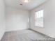 Carpeted bedroom featuring a large window and neutral color scheme at 236 Wheatfield Dr # 102P, Statesville, NC 28677