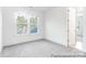 Sunlit bedroom with large windows offering picturesque views of the outdoors at 236 Wheatfield Dr # 102P, Statesville, NC 28677
