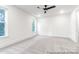 Bright bedroom with ample natural light and a contemporary ceiling fan at 236 Wheatfield Dr # 102P, Statesville, NC 28677