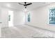 Spacious bedroom with a ceiling fan and neutral walls, perfect for relaxation at 236 Wheatfield Dr # 102P, Statesville, NC 28677