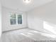 Well-lit, carpeted bedroom with a large window and neutral color scheme at 236 Wheatfield Dr # 102P, Statesville, NC 28677