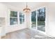 Bright dining area featuring modern lighting and sliding glass doors to the deck at 236 Wheatfield Dr # 102P, Statesville, NC 28677