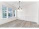 Bright dining area with modern lighting and large windows offering natural light at 236 Wheatfield Dr # 102P, Statesville, NC 28677