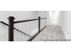 Hallway with carpet flooring and dark wood railing at 236 Wheatfield Dr # 102P, Statesville, NC 28677