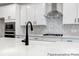 Modern kitchen with stainless steel appliances, white countertops, and stylish backsplash at 236 Wheatfield Dr # 102P, Statesville, NC 28677