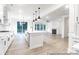 Bright, open kitchen with stainless steel appliances, large island, and seamless flow to the living area at 236 Wheatfield Dr # 102P, Statesville, NC 28677