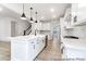 Spacious kitchen with white cabinets, stainless steel appliances, a large island, and open layout at 236 Wheatfield Dr # 102P, Statesville, NC 28677
