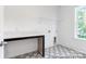 Functional laundry room with countertop space and modern patterned flooring at 236 Wheatfield Dr # 102P, Statesville, NC 28677