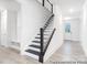 Staircase with dark wood treads and white risers leading to the upper level at 236 Wheatfield Dr # 102P, Statesville, NC 28677