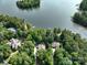 Beautiful aerial view of the property and surrounding trees, including the lake at 258 Patterson'S Bridge None, New London, NC 28127