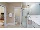 Bathroom with glass enclosed shower, toilet, and access to bedroom at 258 Patterson'S Bridge None, New London, NC 28127